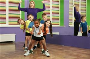 Teacher and kids in dance class