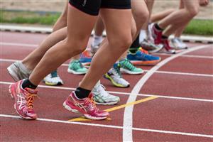 Track and field runners at the starting block